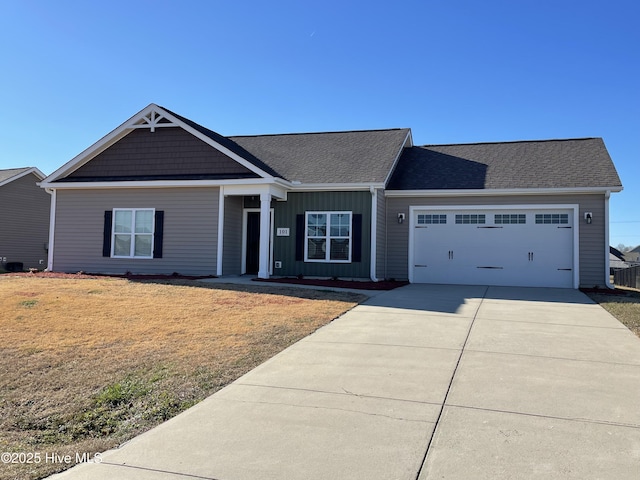 view of front facade with a garage and a front lawn