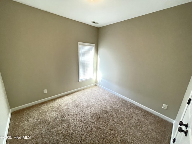 empty room featuring carpet floors