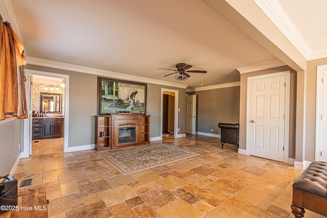 living room featuring ceiling fan and ornamental molding