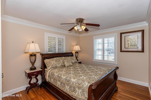 bedroom with ceiling fan, dark hardwood / wood-style floors, crown molding, and multiple windows