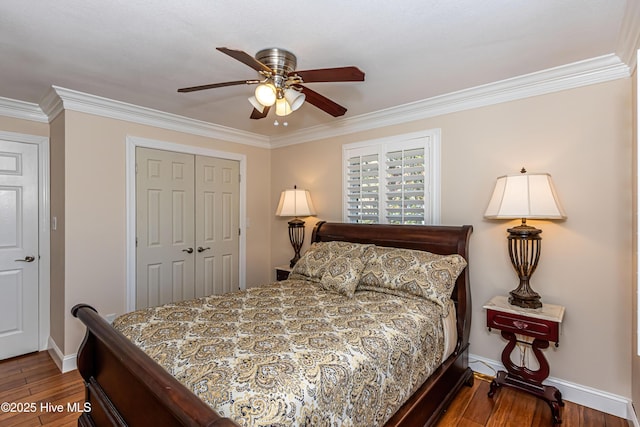 bedroom featuring ceiling fan, a closet, crown molding, and wood-type flooring