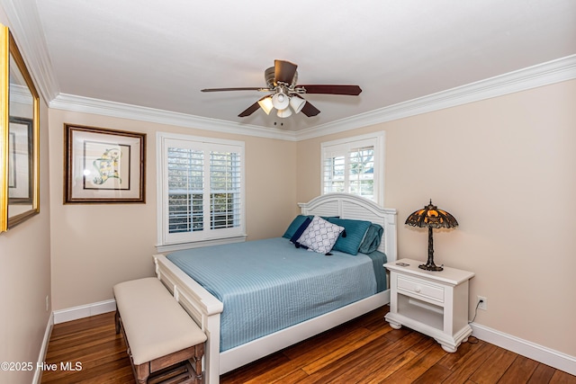 bedroom featuring dark hardwood / wood-style floors, ceiling fan, and crown molding