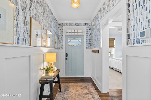 entryway featuring dark wood-type flooring and ornamental molding