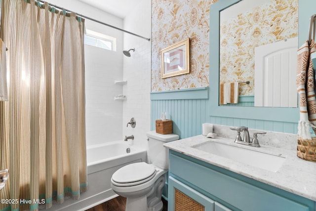 full bathroom featuring shower / tub combo, vanity, and toilet