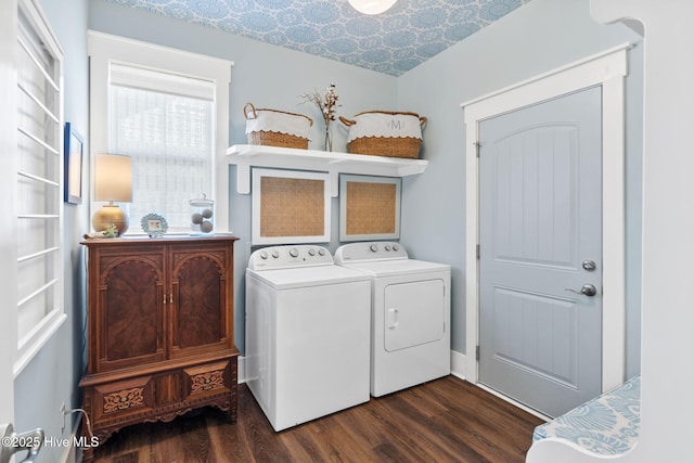 laundry area featuring dark wood-type flooring and washer and clothes dryer