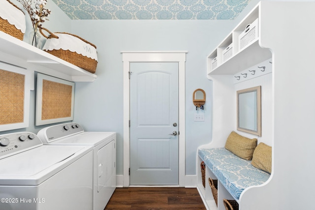 clothes washing area featuring dark wood-type flooring and washing machine and clothes dryer