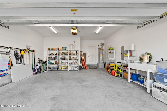 garage featuring a garage door opener and water heater