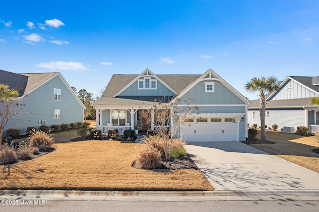 view of front facade with a garage and covered porch