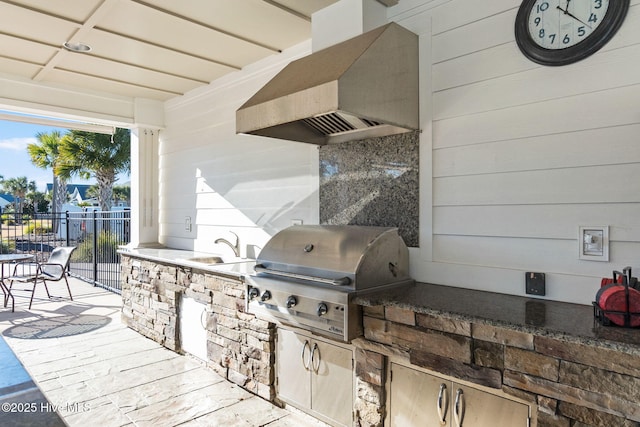 view of patio featuring exterior kitchen, a grill, and sink