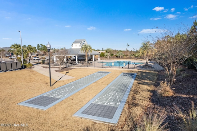 view of property's community featuring a pool and a pergola