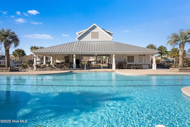 view of swimming pool with a patio area