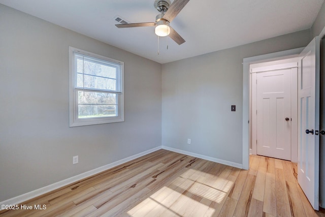 unfurnished room featuring ceiling fan and light hardwood / wood-style floors