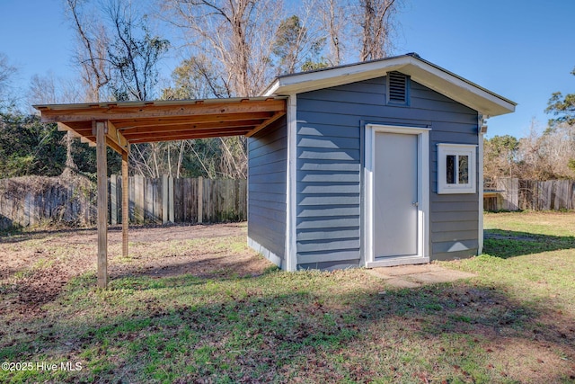 view of outbuilding with a lawn