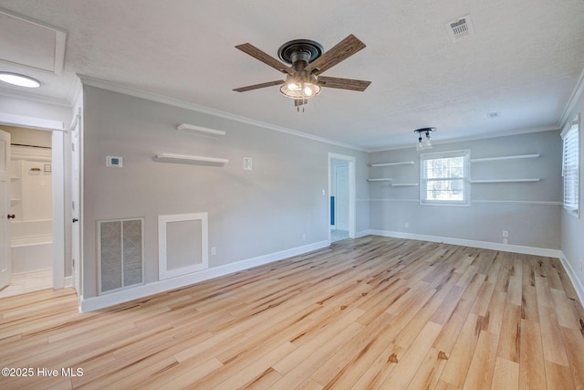 spare room featuring crown molding, ceiling fan, light hardwood / wood-style floors, and a textured ceiling