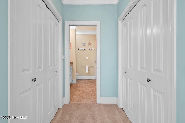 corridor with light tile patterned floors