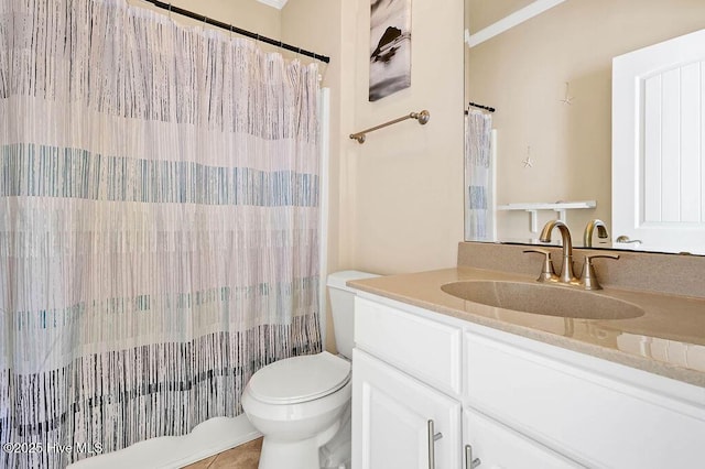 bathroom featuring tile patterned flooring, vanity, and toilet