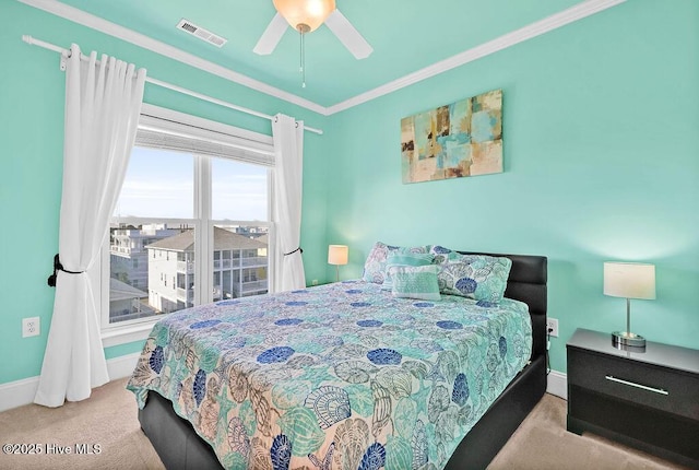 bedroom featuring ceiling fan, light colored carpet, and ornamental molding