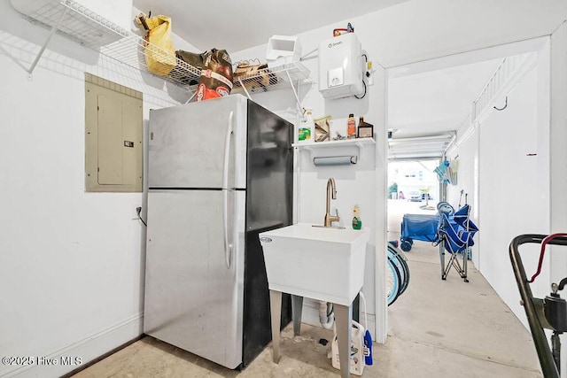 kitchen featuring stainless steel fridge and electric panel