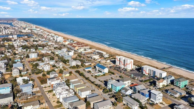 drone / aerial view featuring a beach view and a water view