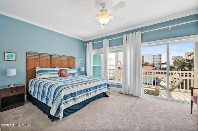 carpeted bedroom with access to outside, ceiling fan, and crown molding