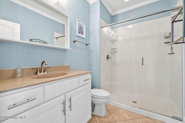 bathroom with vanity, tile patterned flooring, toilet, ornamental molding, and walk in shower