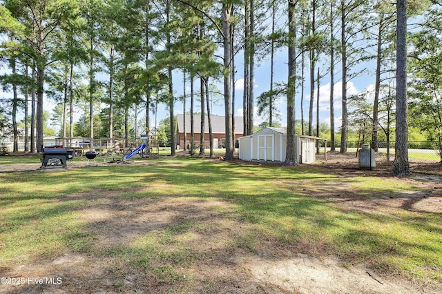 view of yard featuring a shed and a playground