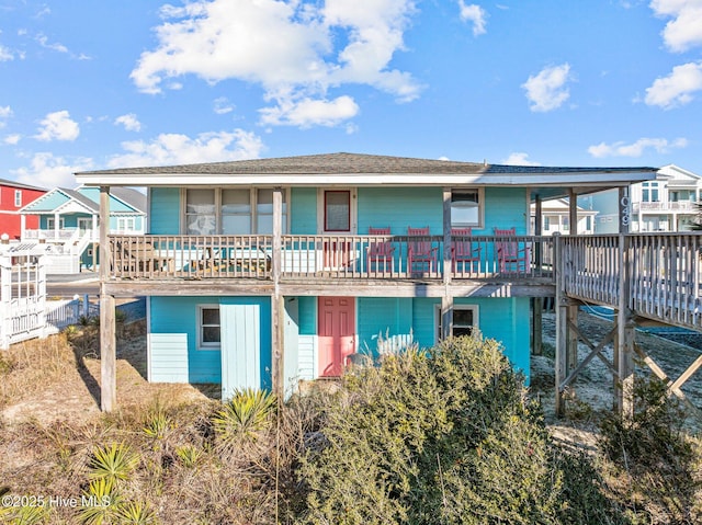 back of property featuring a deck