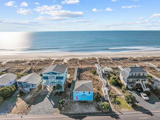 birds eye view of property featuring a view of the beach and a water view