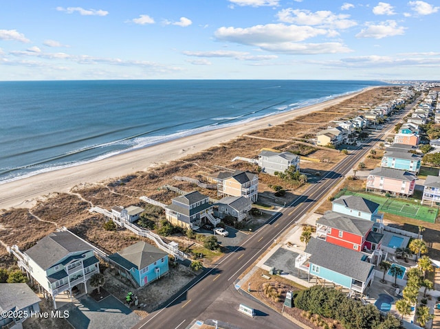 aerial view featuring a view of the beach and a water view