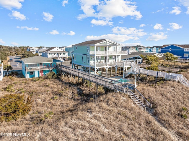 rear view of property with a balcony