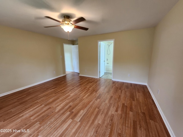 unfurnished room with ceiling fan and light wood-type flooring