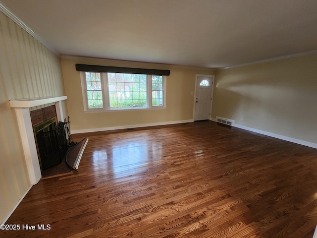 unfurnished living room featuring crown molding and dark hardwood / wood-style flooring