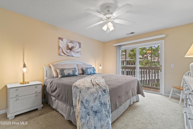 bedroom with ceiling fan, light colored carpet, a textured ceiling, and access to outside