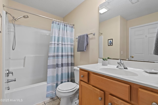 full bathroom featuring a textured ceiling, tile patterned flooring, vanity, toilet, and shower / bath combo with shower curtain