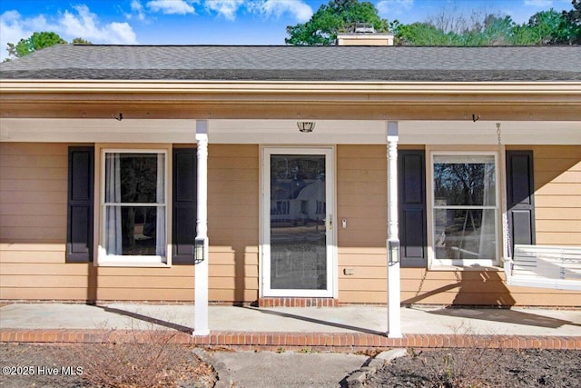 property entrance featuring a porch