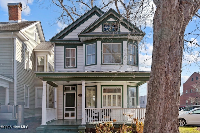 victorian house featuring a porch