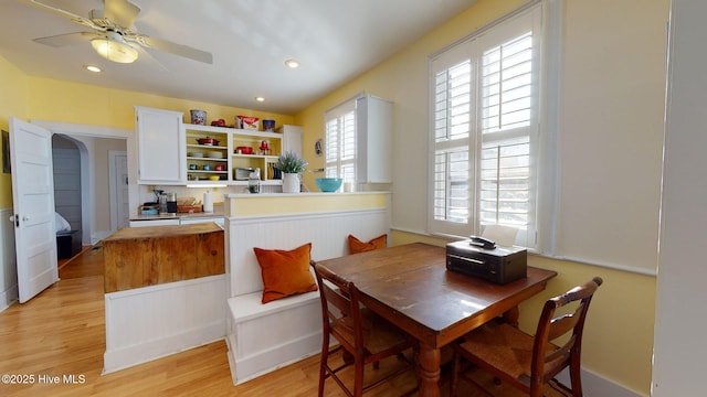 dining area featuring ceiling fan and light wood-type flooring