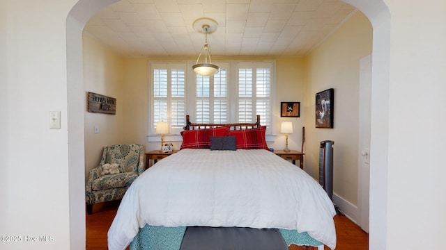 bedroom with hardwood / wood-style flooring