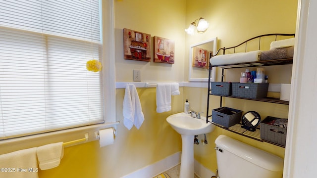 bathroom featuring tile patterned flooring and toilet