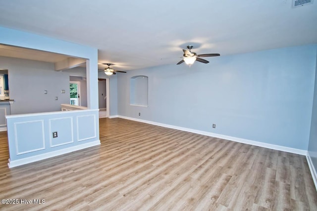 unfurnished living room featuring ceiling fan and light wood-type flooring