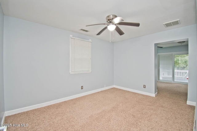 unfurnished room featuring light carpet and ceiling fan