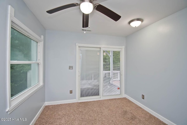 empty room with carpet and ceiling fan