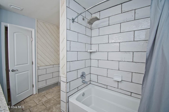 bathroom featuring shower / bathtub combination with curtain