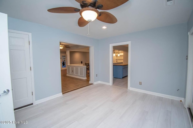 empty room with light hardwood / wood-style flooring