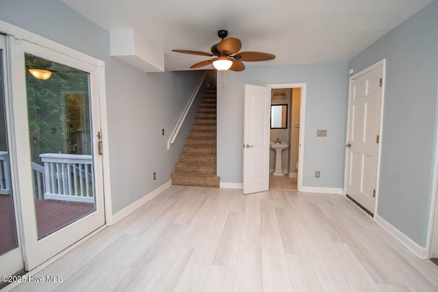 interior space featuring ceiling fan, light hardwood / wood-style flooring, and sink