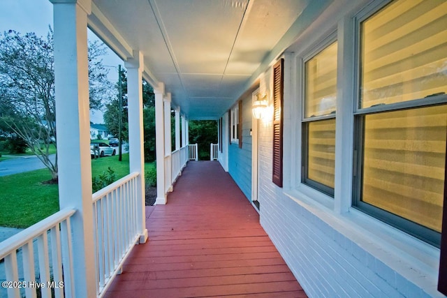 wooden terrace featuring a porch