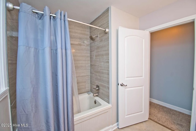 bathroom with tile patterned floors and shower / tub combo with curtain