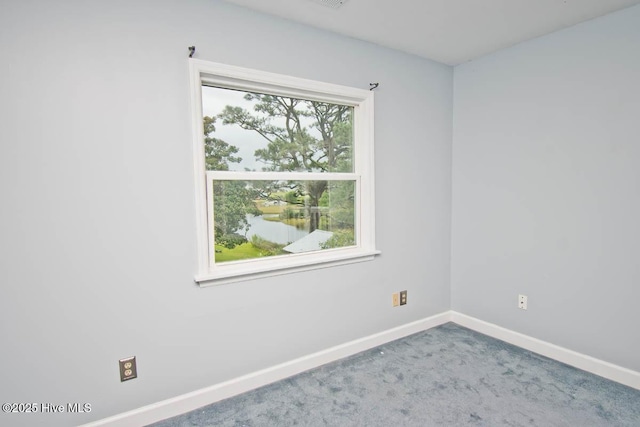 carpeted empty room with plenty of natural light