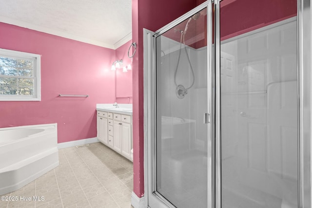 bathroom with vanity, crown molding, and walk in shower