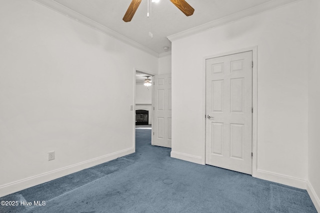 unfurnished bedroom with carpet floors, ceiling fan, and ornamental molding